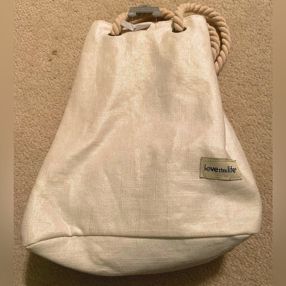 New Love This Life - cream and gold thread satchel. Rope handle drawstring.